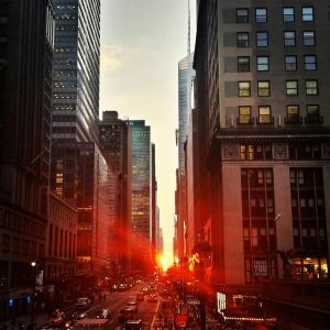 Captivating sunset view down a bustling street in Manhattan, New York City.